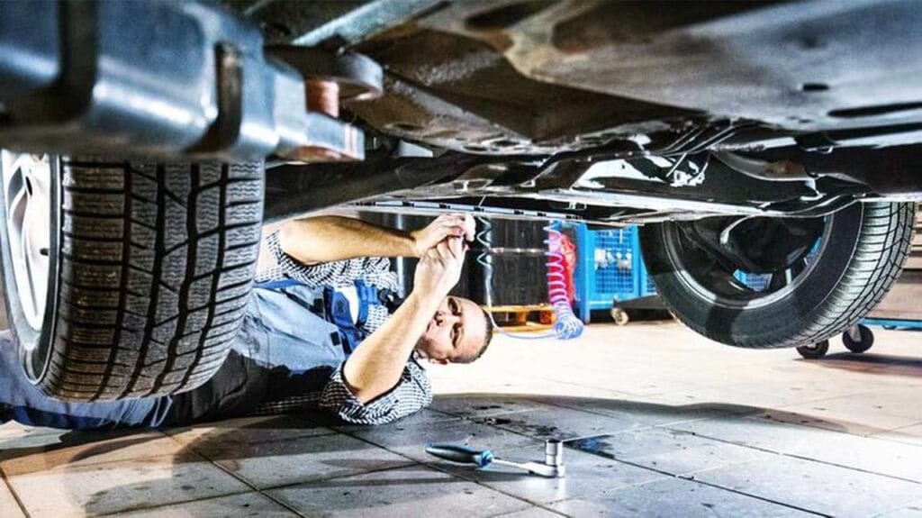 Mobile mechanic service van parked with technician ready to inspect vehicle on-site